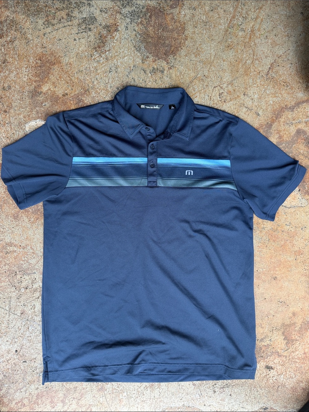 Travis Mathew Navy Polo with Blue Stripe Detail
